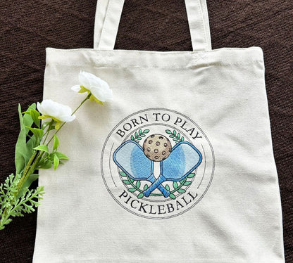 Handmade Embroidered Tote bag with 'Born to Play Pickleball' design on a 100% natural cotton tote bag with reinforced handles.