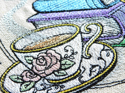 Embroidered design of a teacup with a rose on a white background for a personalized tote bag in Calgary